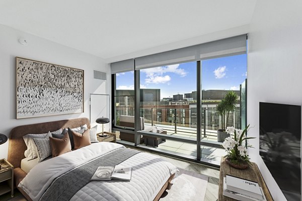 Elegant bedroom with modern decor at Crossing DC Apartments