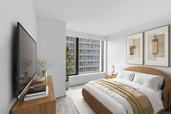 Bedroom with contemporary decor and ample natural light at Crossing DC Apartments, a Greystar luxury property in Washington, DC