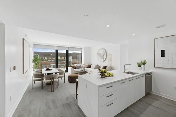 Spacious kitchen with modern appliances and granite countertops at Crossing DC Apartments