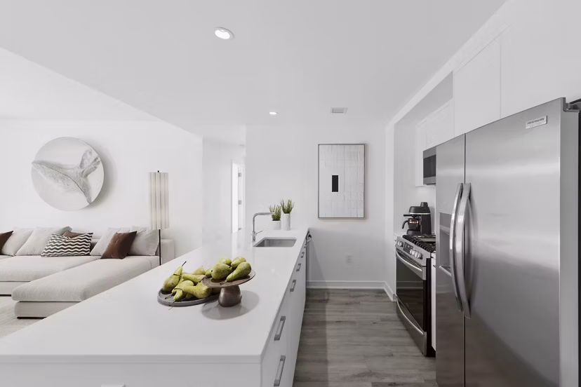 Modern kitchen with stainless steel appliances in Crossing DC Apartments