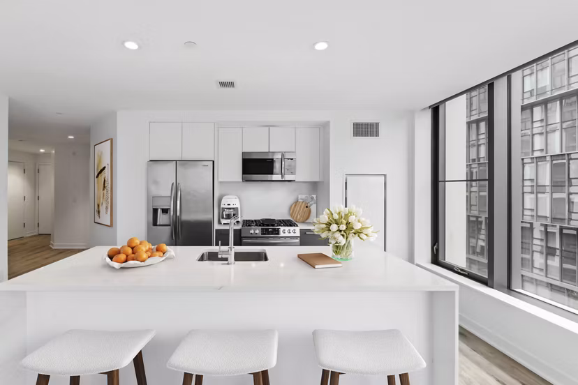 Modern kitchen with stainless steel appliances at Crossing DC Apartments