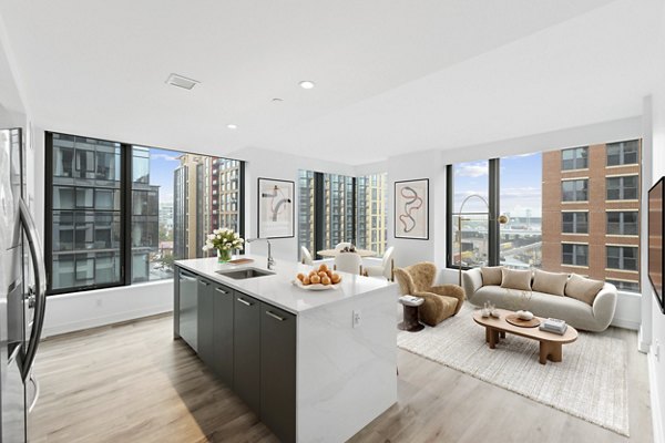 Modern kitchen with stainless steel appliances at Crossing DC Apartments