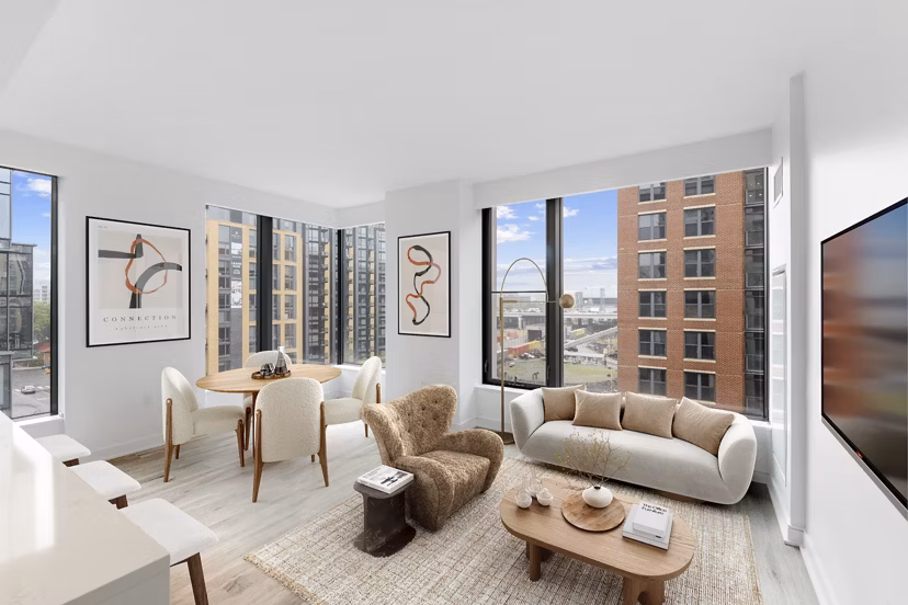 Cozy living room with modern decor at Crossing DC Apartments, featuring comfortable seating and stylish coffee table in vibrant Washington, DC