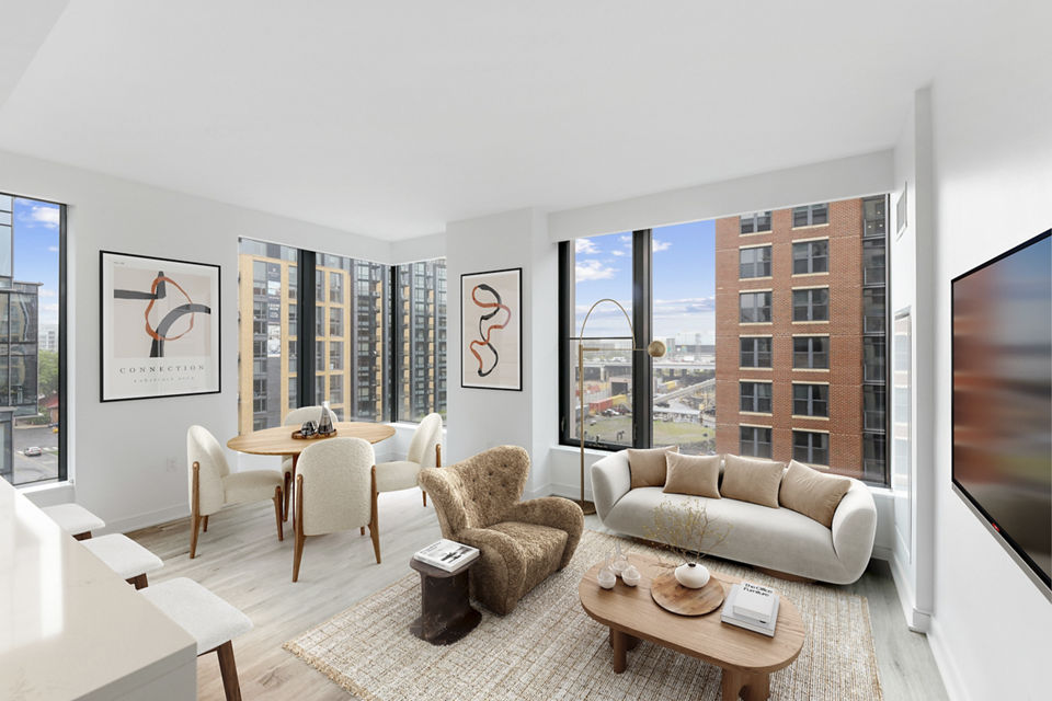 Cozy living room with modern decor at Crossing DC Apartments, featuring comfortable seating and stylish coffee table in vibrant Washington, DC