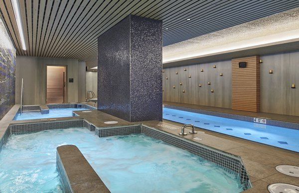 Indoor pool with sleek design at Crossing DC Apartments, offering luxury leisure space in a prime location