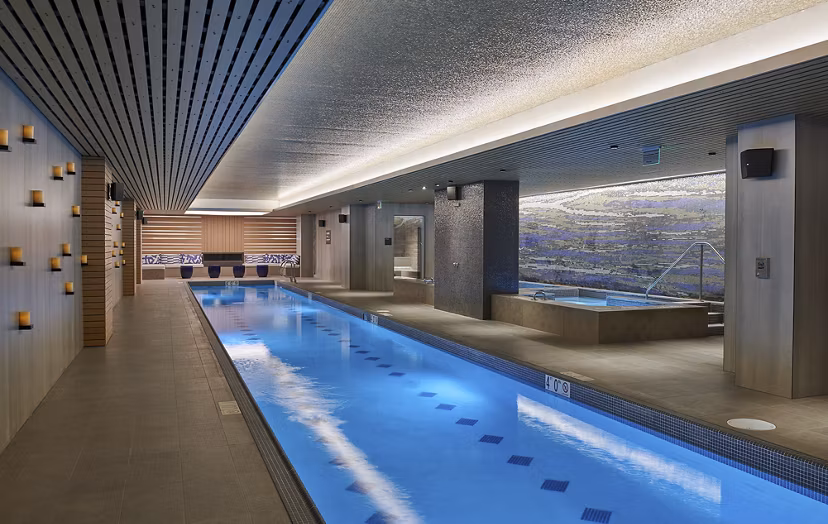 Luxurious indoor pool at Crossing DC Apartments, stylish oasis for relaxation and fitness