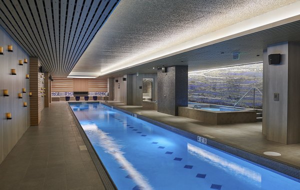 Luxurious indoor pool at Crossing DC Apartments, stylish oasis for relaxation and fitness