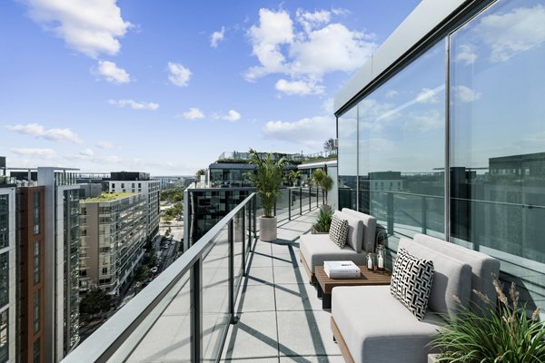 Elegant patio space with modern outdoor seating at Crossing DC Apartments, Greystar luxury community in vibrant Washington DC