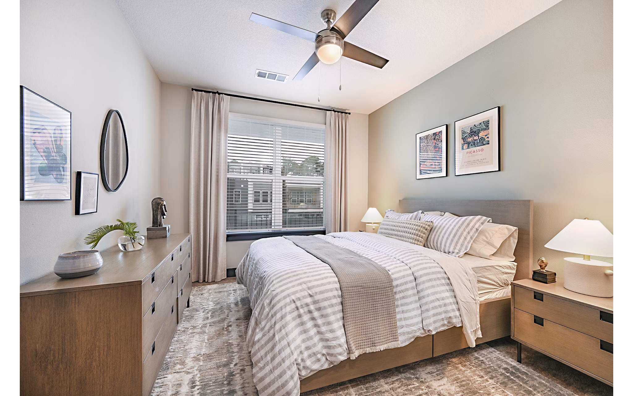 Cozy bedroom with elegant decor at Presidium Park Apartments featuring luxury bedding and soothing color palette