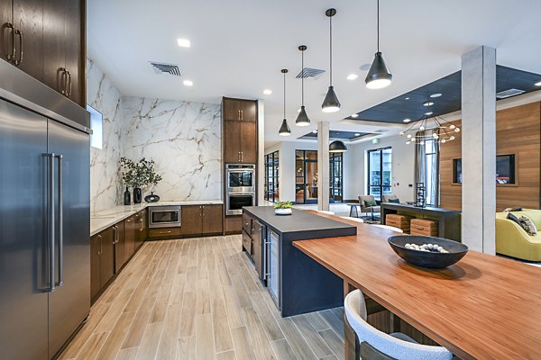 Clubhouse with modern decor and seating areas at Presidium Park Apartments, luxury living offered by Greystar