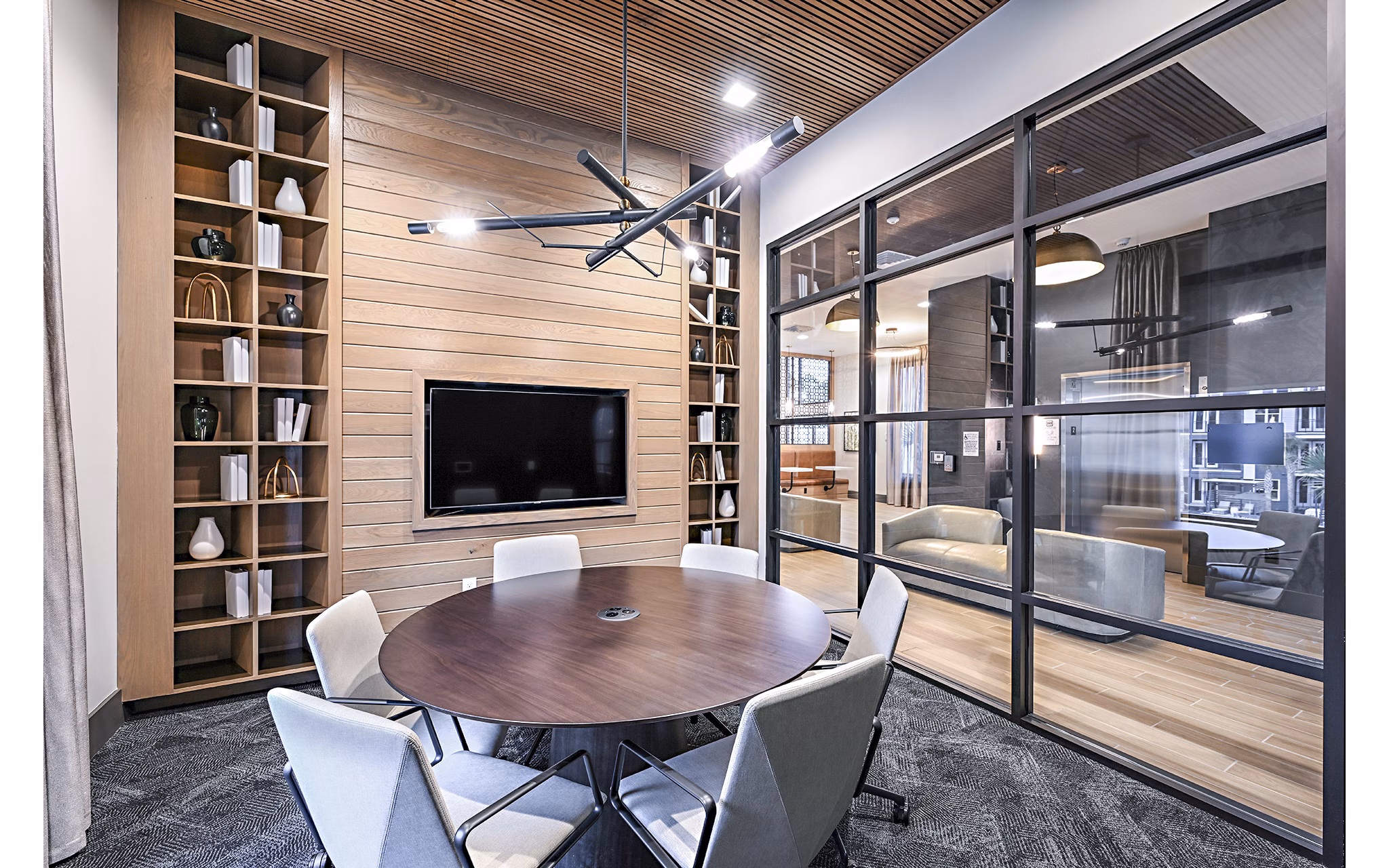 Spacious clubhouse meeting facility at Presidium Park Apartments featuring modern design and ample seating options