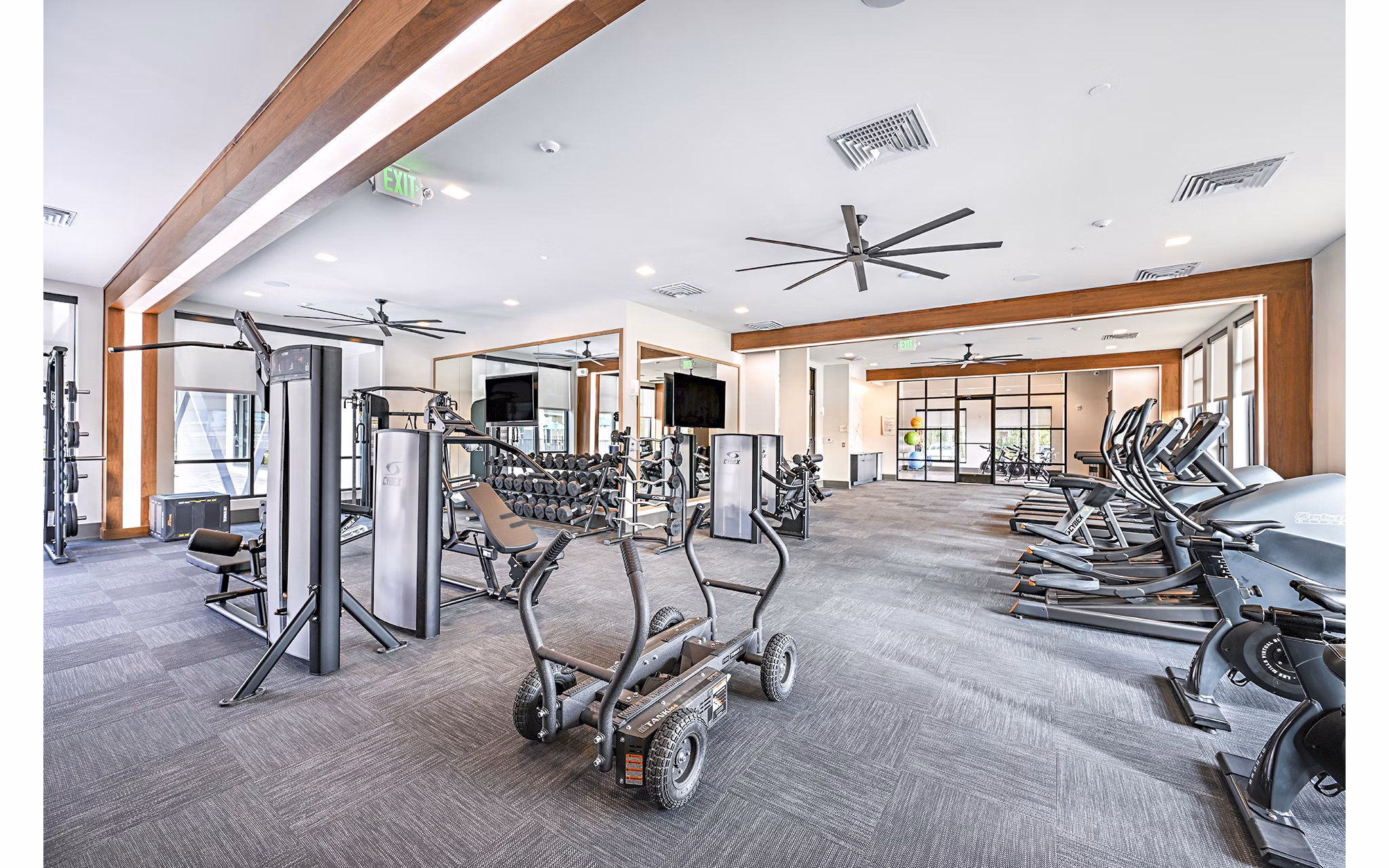 Fitness center at Presidium Park Apartments with modern gym equipment and spacious workout area