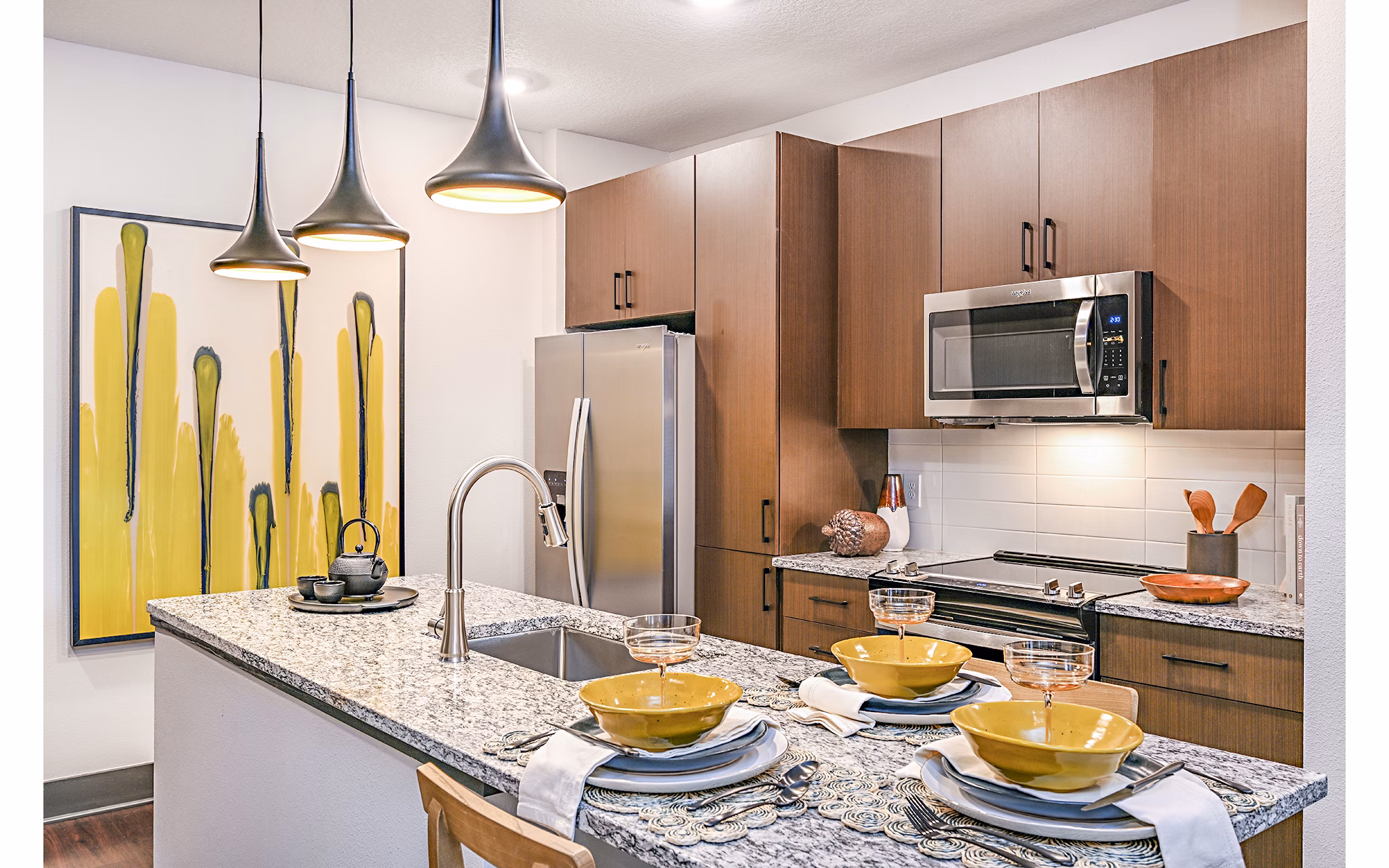 Modern kitchen with stylish cabinetry and stainless steel appliances at Presidium Park Apartments