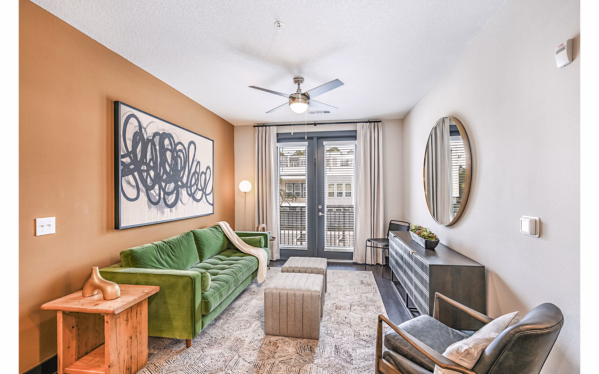 Spacious living room with modern decor and natural light in Presidium Park Apartments