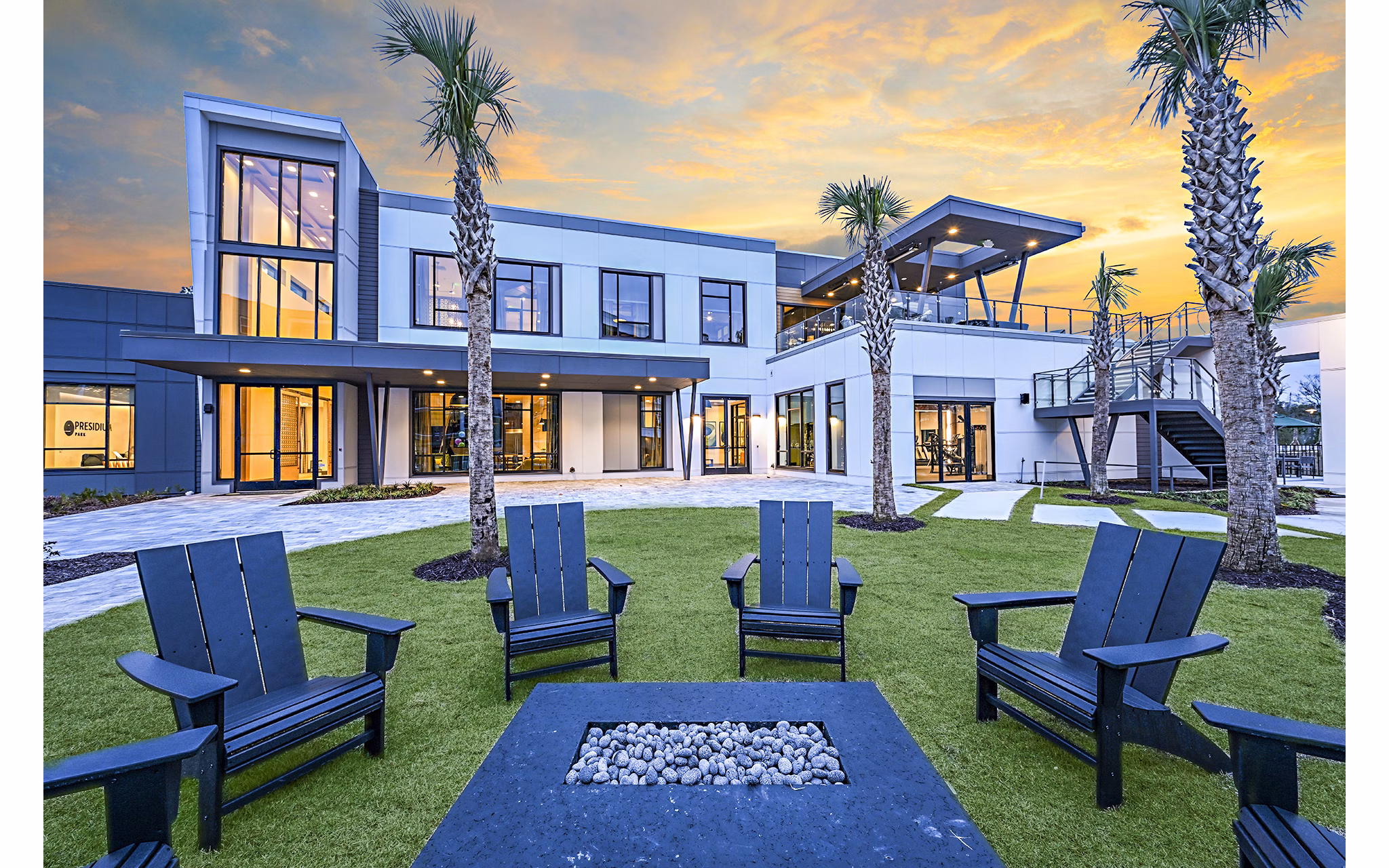 Fire pit and cozy seating on patio at Presidium Park Apartments