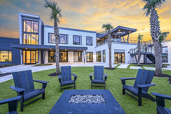 Fire pit and cozy seating on patio at Presidium Park Apartments