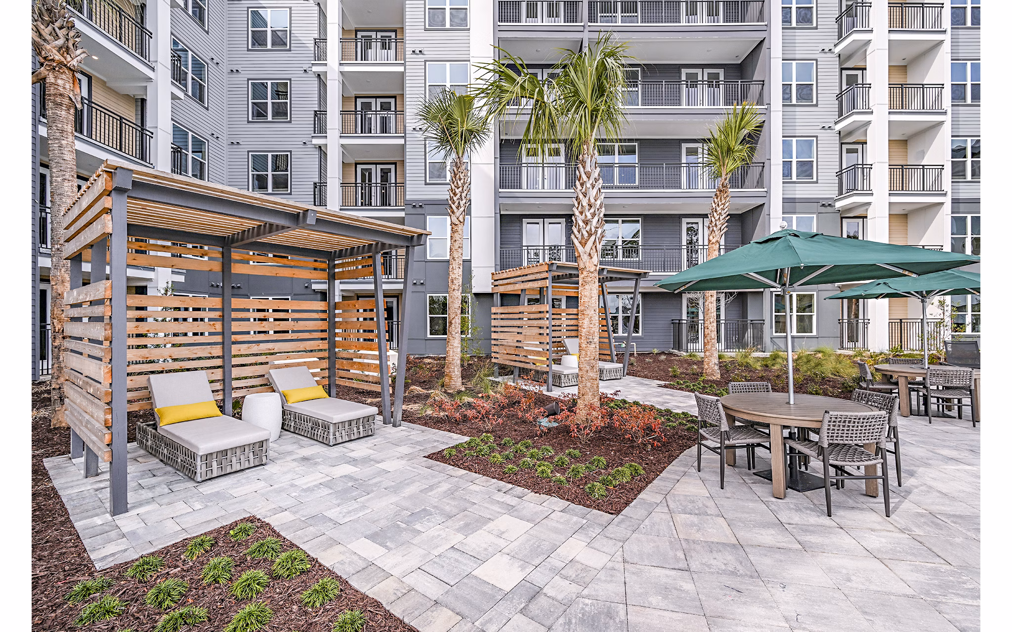 Poolside cabana at Presidium Park Apartments offering shaded seating and relaxation area