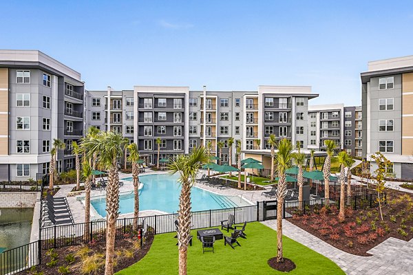 Tranquil outdoor pool area at Presidium Park Apartments, perfect for relaxation and recreation in a luxury living environment