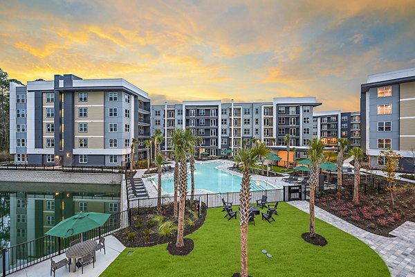 Outdoor pool with lounge chairs at Presidium Park Apartments offering luxury living in a serene setting