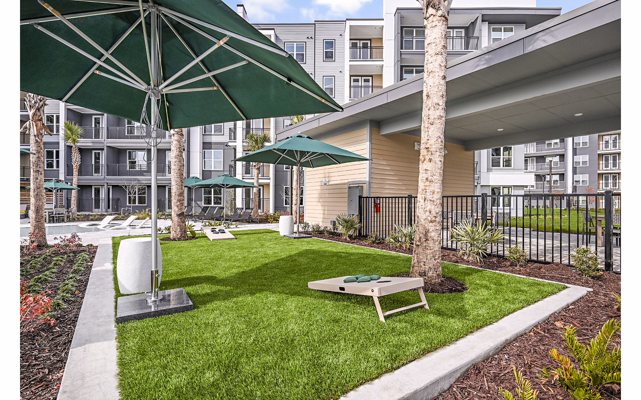 Recreational area with lounge seating and greenery at Presidium Park Apartments, offering luxury living amenities in modern Greenville location