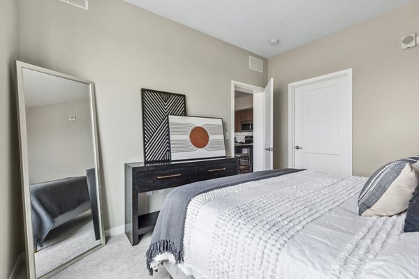 Cozy bedroom with modern dÃ©cor at The Eddi Apartments