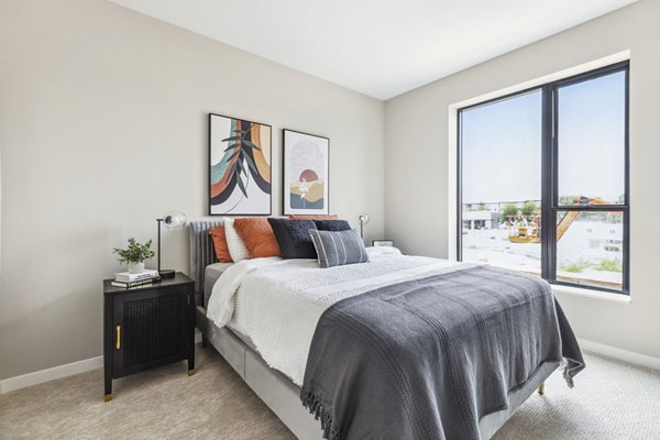 Modern bedroom with elegant decor at The Eddi Apartments