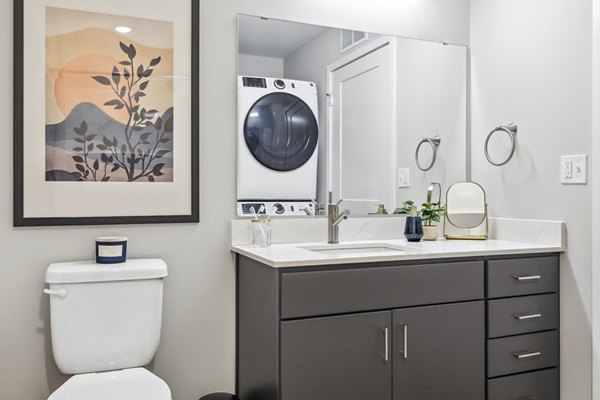 Modern bathroom featuring sleek fixtures at The Eddi Apartments in luxury Greystar community