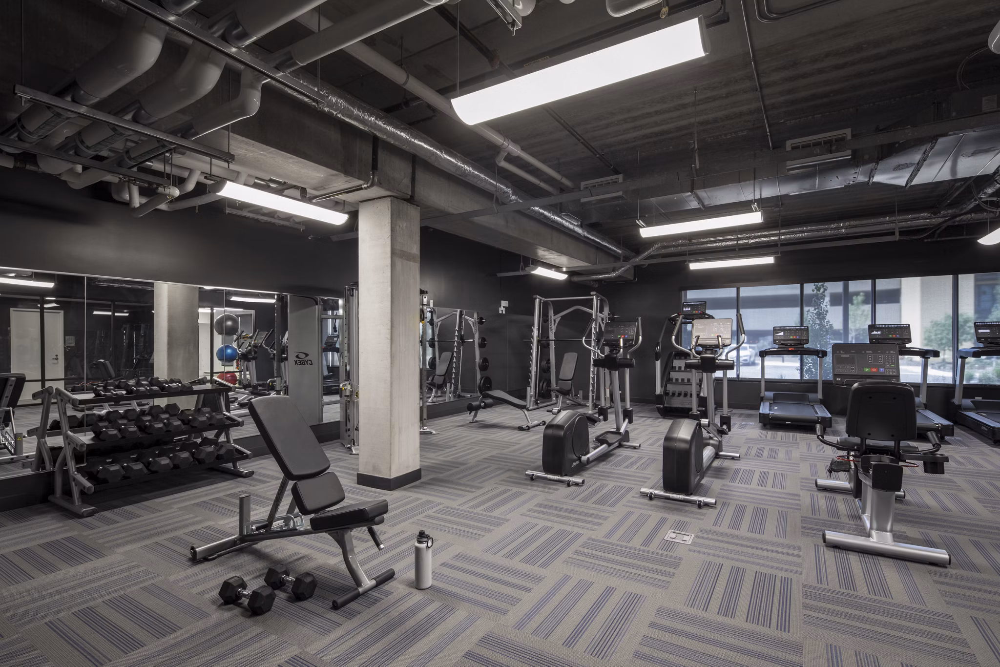 fitness center at The Eddi Apartments