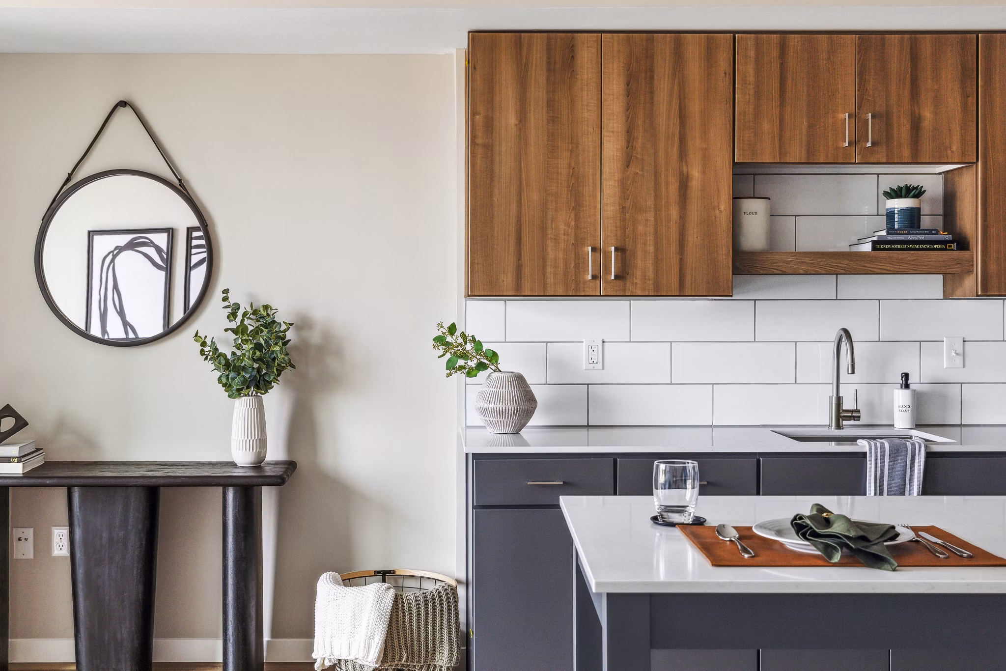 Contemporary kitchen featuring stainless steel appliances at The Eddi Apartments