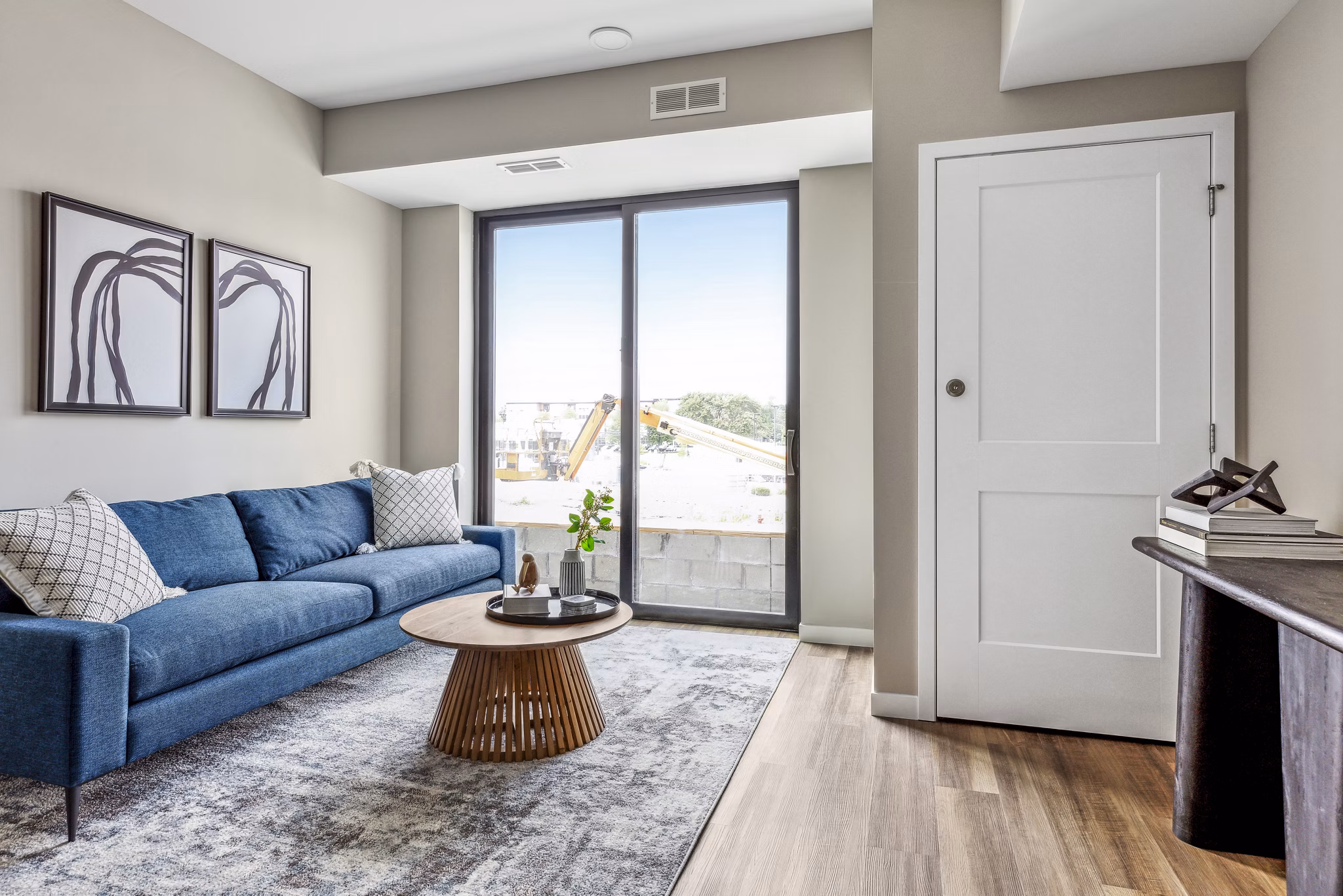 Spacious living room with modern decor at The Eddi Apartments