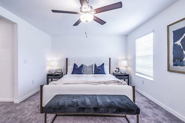 Elegant bedroom with modern decor at Balcara 301, Sun City Apartments
