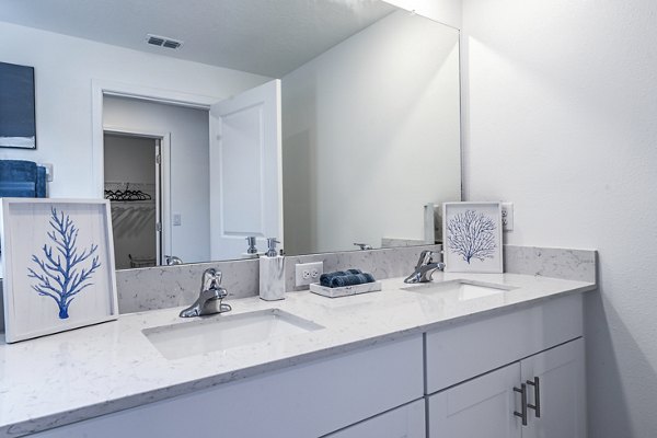 Luxurious bathroom with sleek fixtures at Balcara 301 in Sun City Apartments, offering modern amenities and elegant design