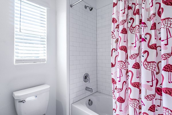 Bathroom with marble countertops and modern fixtures at Balcara 301 in Sun City Apartments