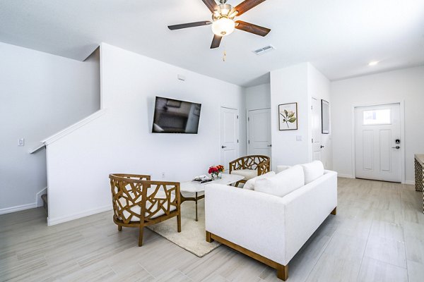 Spacious living room with modern decor in Balcara 301 at Sun City Apartments
