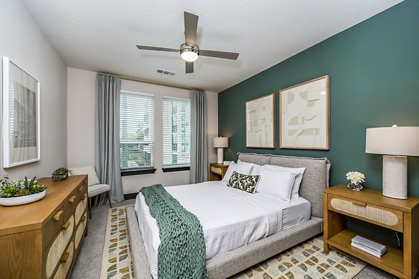 Luxurious bedroom with contemporary design at Presidium Regal Apartments