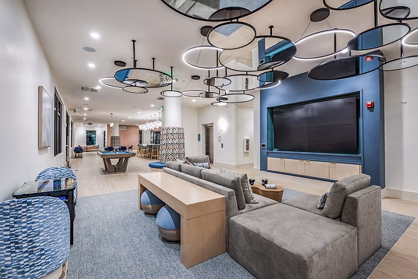 Clubhouse theater with plush seating and large screen at Presidium Regal Apartments, perfect for entertainment and relaxation