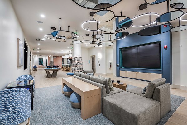 Clubhouse theater with plush seating and large screen at Presidium Regal Apartments, perfect for entertainment and relaxation