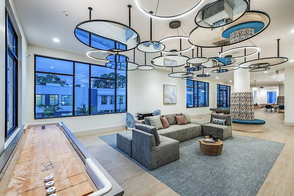 Clubhouse game room featuring pool table and seating area at Presidium Regal Apartments