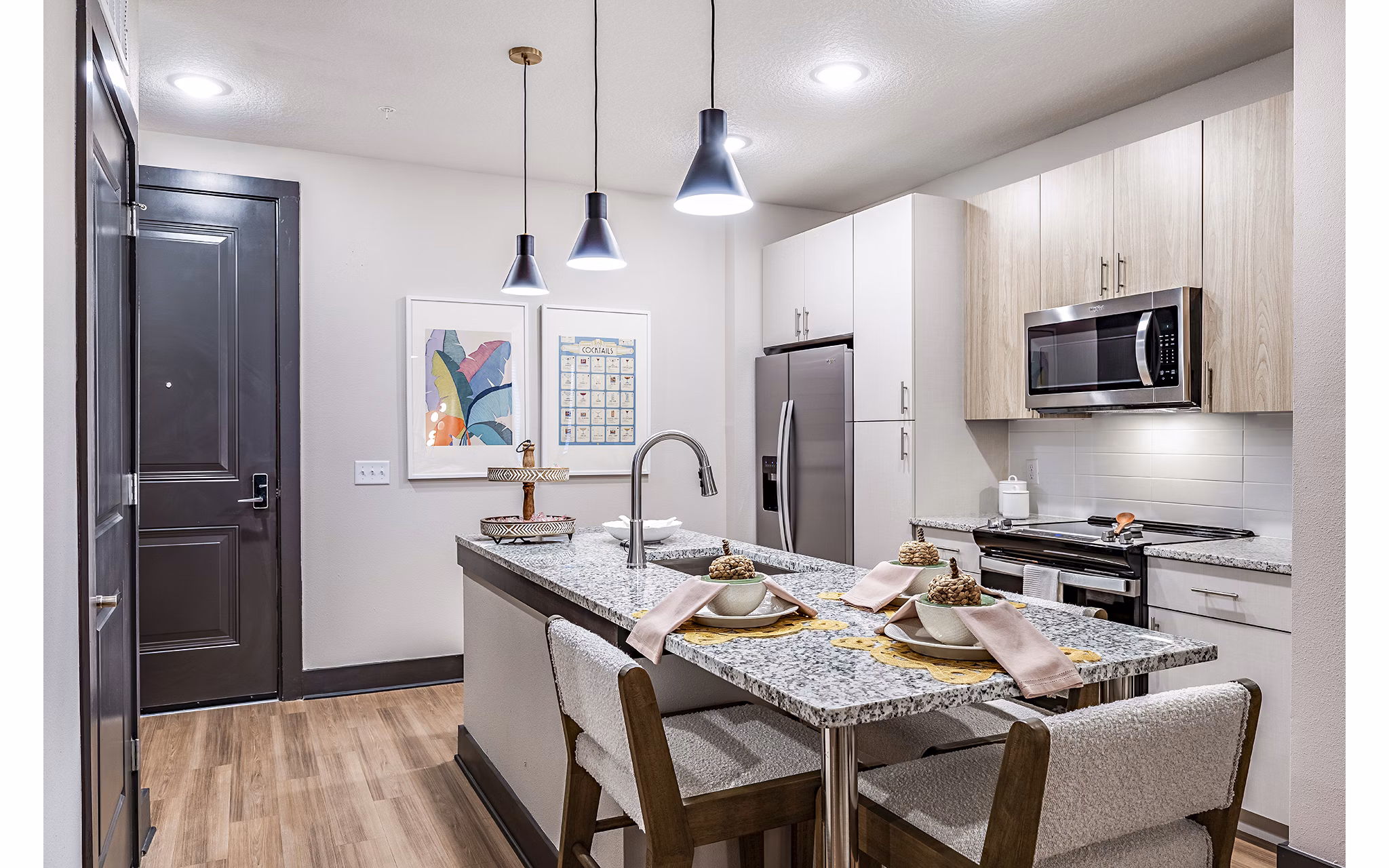 Kitchen with modern appliances and marble countertops at Presidium Regal Apartments, luxury living space