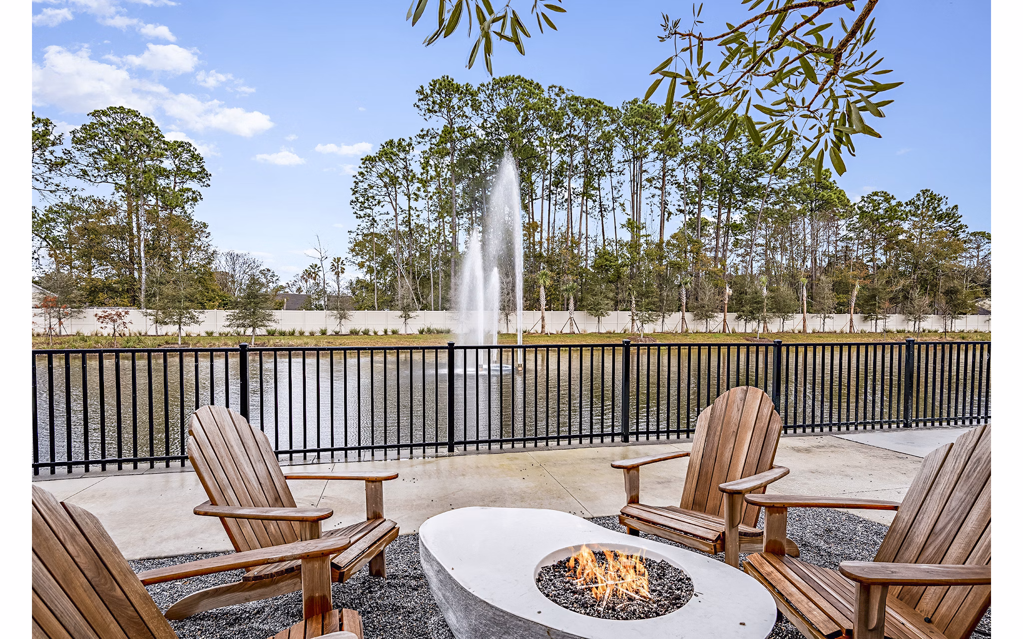 Fire pit on a modern patio at Presidium Regal Apartments, a luxury living destination