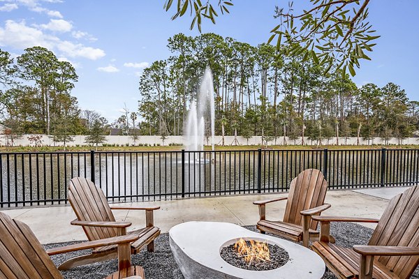 Fire pit on a modern patio at Presidium Regal Apartments, a luxury living destination