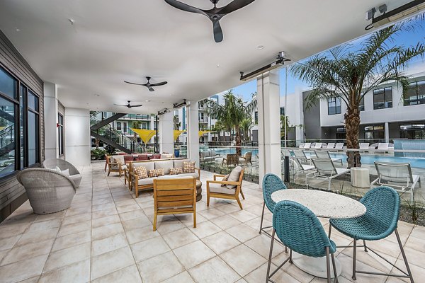Fire pit on patio at Presidium Regal Apartments, a luxury feature for outdoor relaxation
