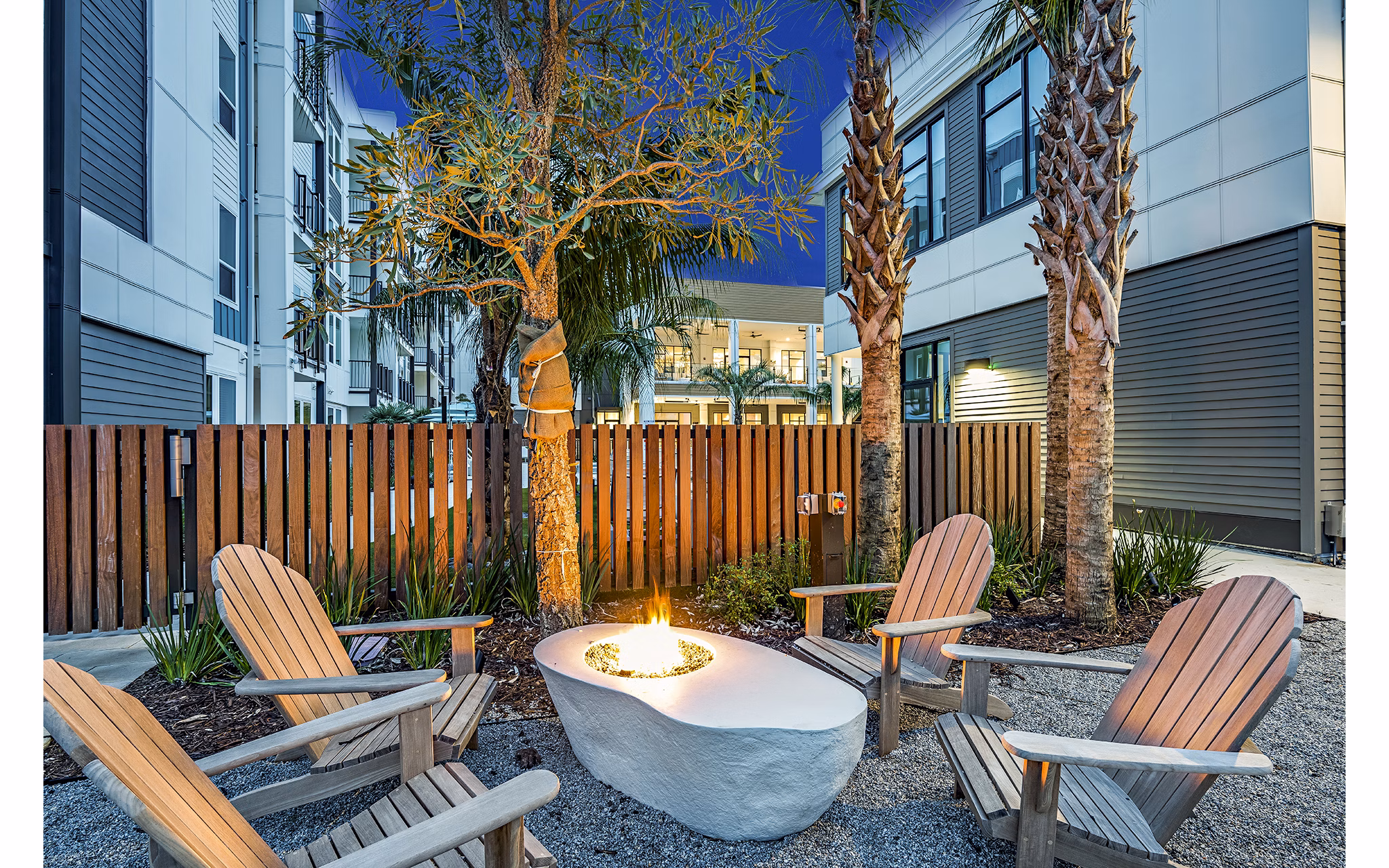 Cozy fire pit on the patio at Presidium Regal Apartments, creating a perfect outdoor gathering space in this luxurious complex