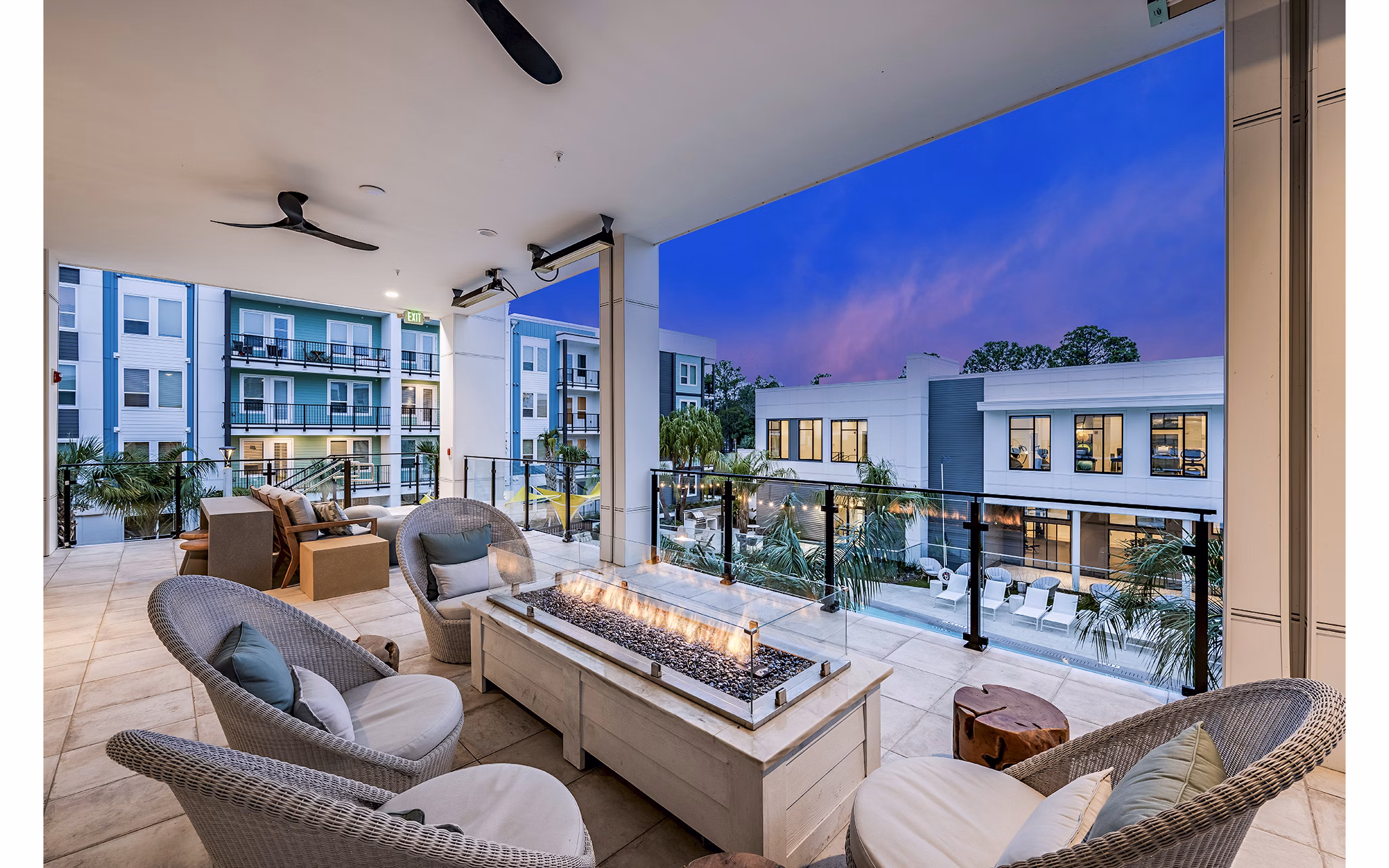 Fire pit and patio area at Presidium Regal Apartments offering outdoor relaxation and socializing options
