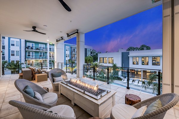 Fire pit and patio area at Presidium Regal Apartments offering outdoor relaxation and socializing options