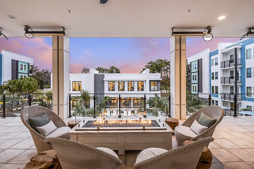 Inviting outdoor fire pit and patio at Presidium Regal Apartments, perfect for social gatherings and relaxation