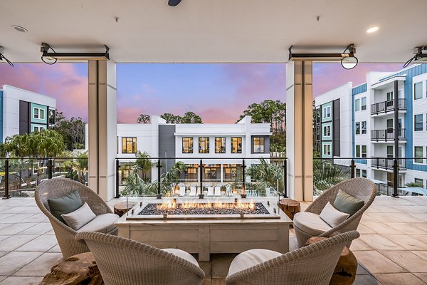 Inviting outdoor fire pit and patio at Presidium Regal Apartments, perfect for social gatherings and relaxation