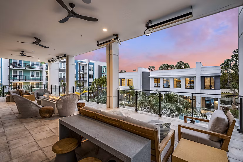 Outdoor fire pit and patio at Presidium Regal Apartments, perfect for social gatherings and relaxation in a luxurious setting