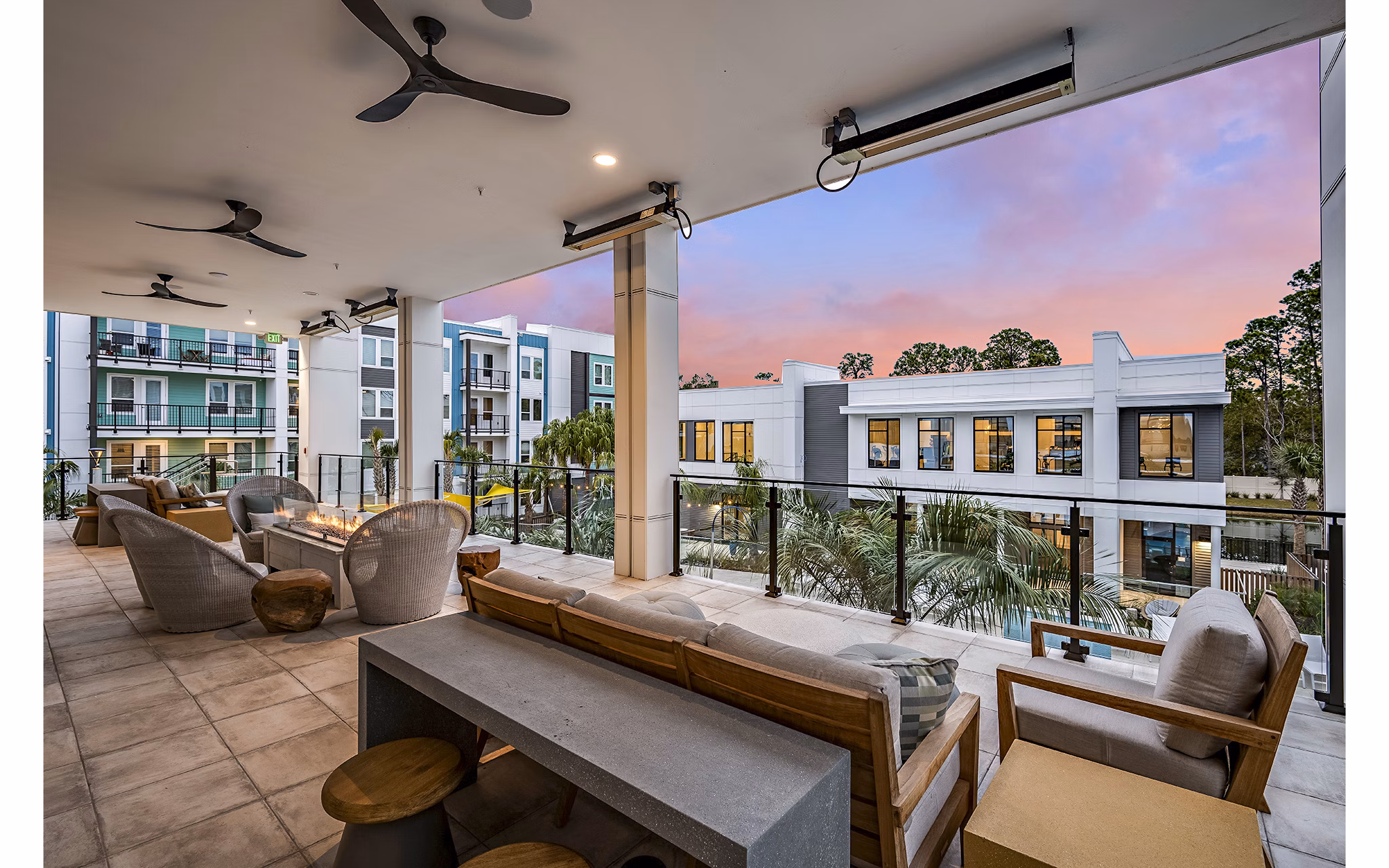 Outdoor fire pit and patio at Presidium Regal Apartments, perfect for social gatherings and relaxation in a luxurious setting