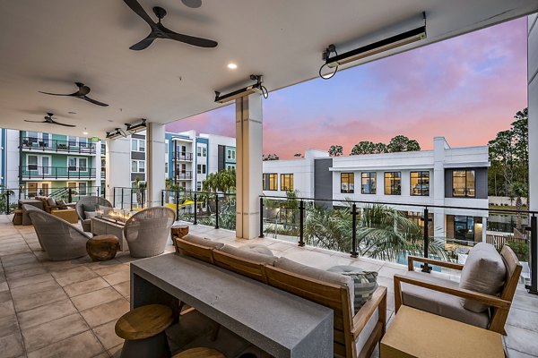 Outdoor fire pit and patio at Presidium Regal Apartments, perfect for social gatherings and relaxation in a luxurious setting